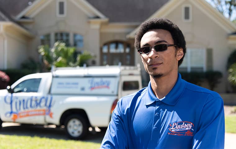 a technician standing in front of a yulee florida home