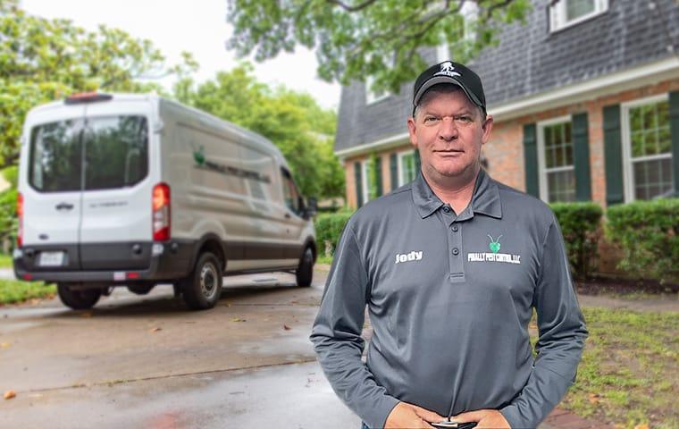 Protect Your Indiana Home From Ants & Spiders a finally pest control technician standing outside in indianapolis indiana