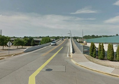 This 6-foot sidewalk is a bridge crossing over railroad tracks.