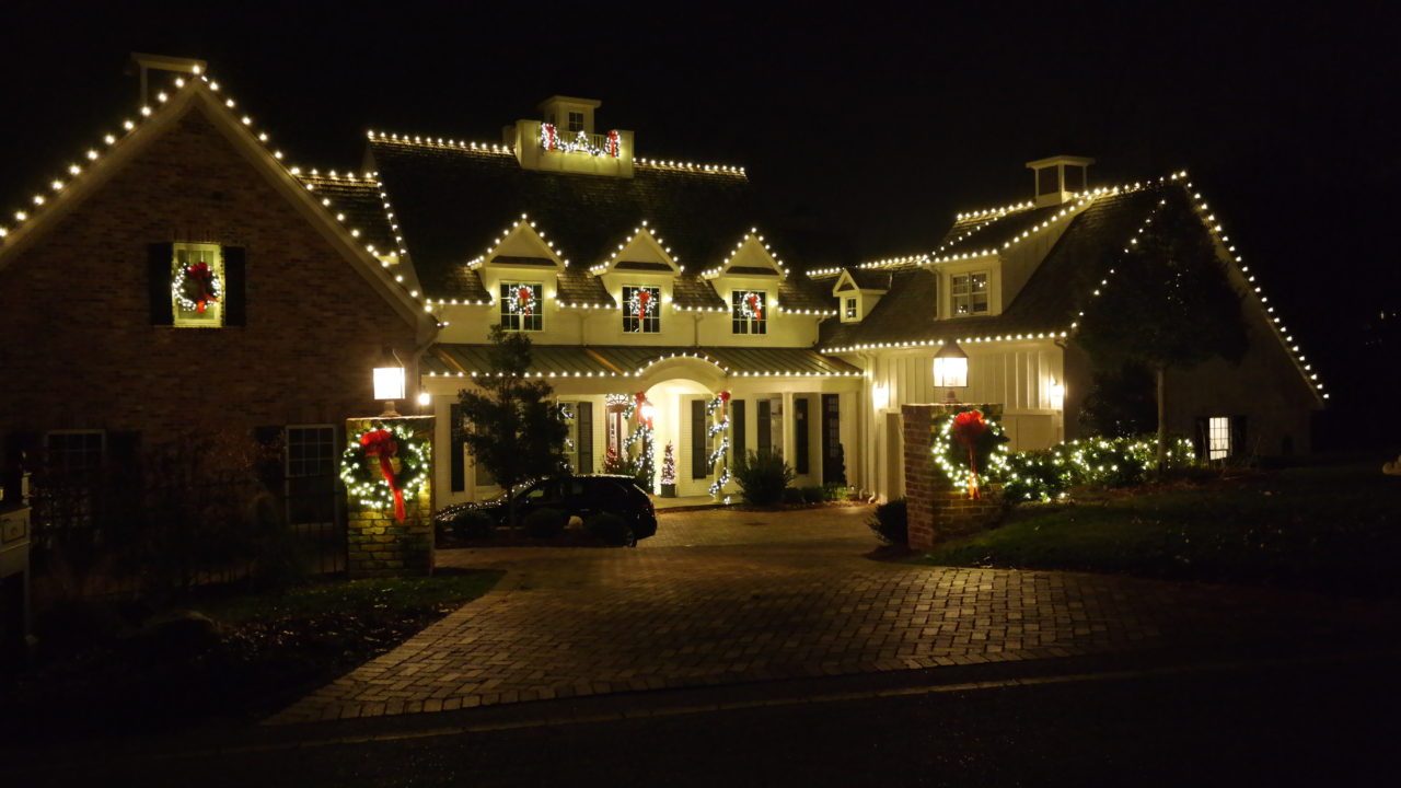 street view of a house decorated with christmas lights