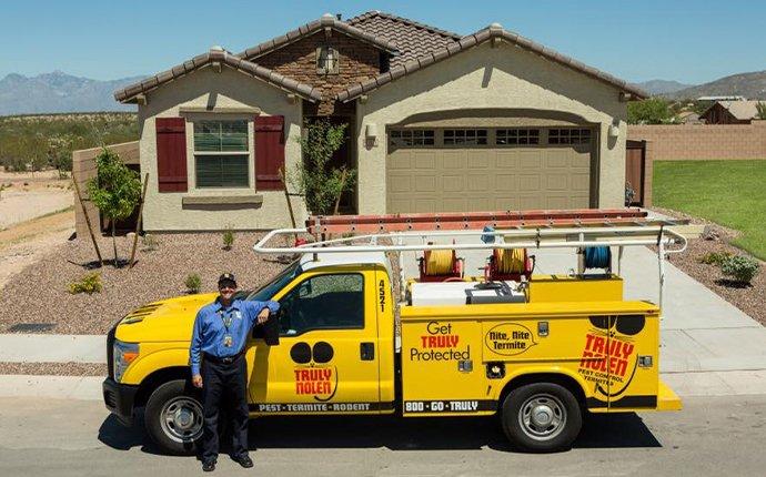 technician in front of residential home