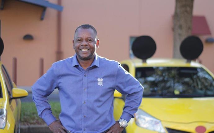 man in front of truly nolen vehicle