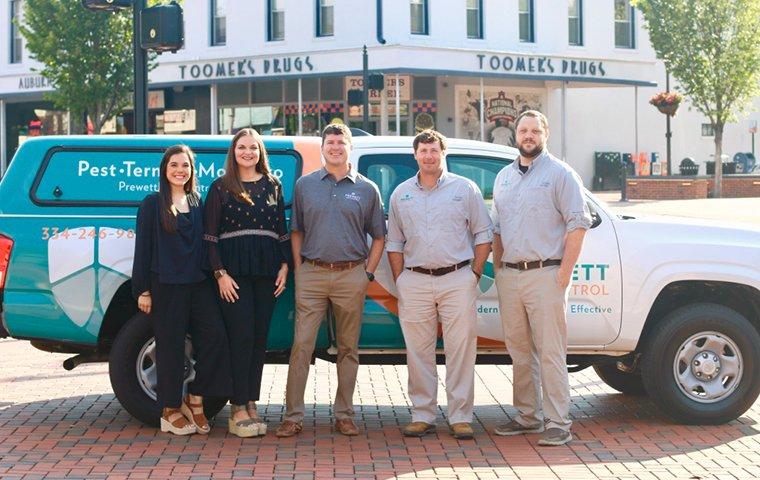 team photo standing with company truck