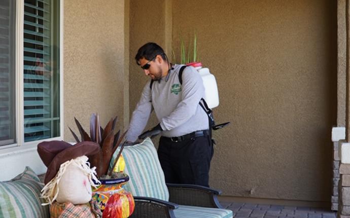 Our Technicians Are Friendly And Local technician inspecting exterior