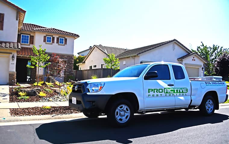a white pro active service truck in front of a rocklin home