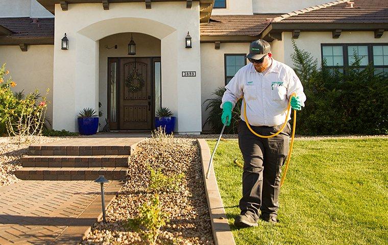 tech treating the walkway of a home in sacramento california