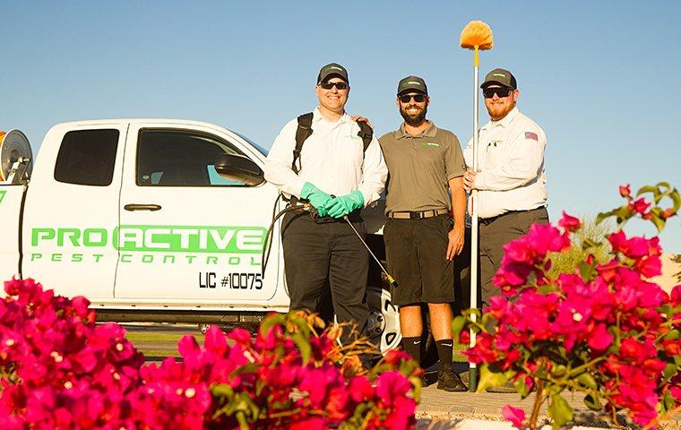 three technicians outside a commercial building