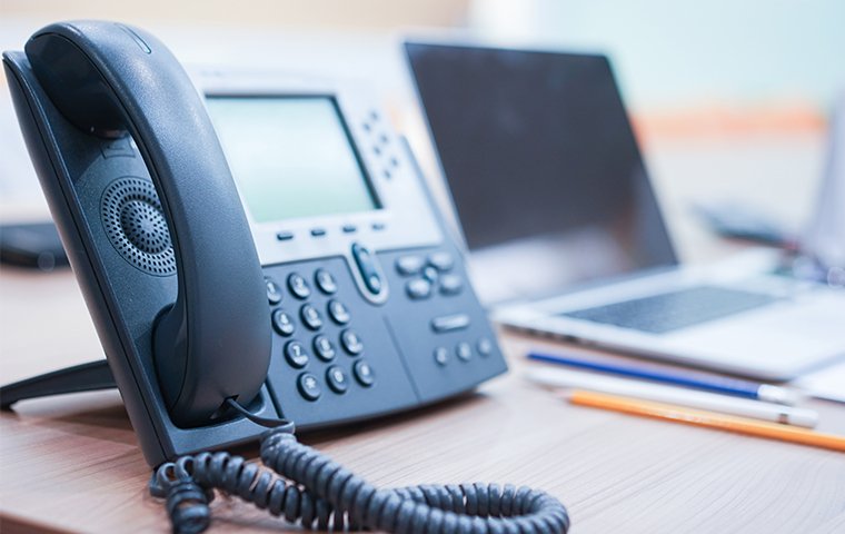 an office phone on a desk