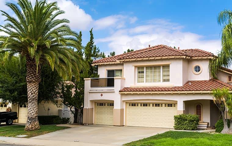 a two story house with attached garage
