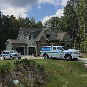 company trucks outside house