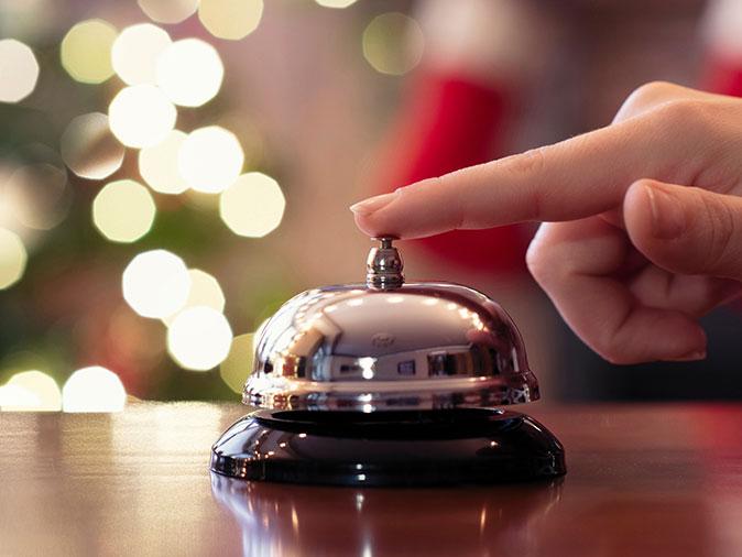 bell at front desk of a bed bug infested hotel in colorado