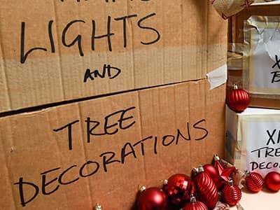 cardboard boxes used to store christmas lights and decorations
