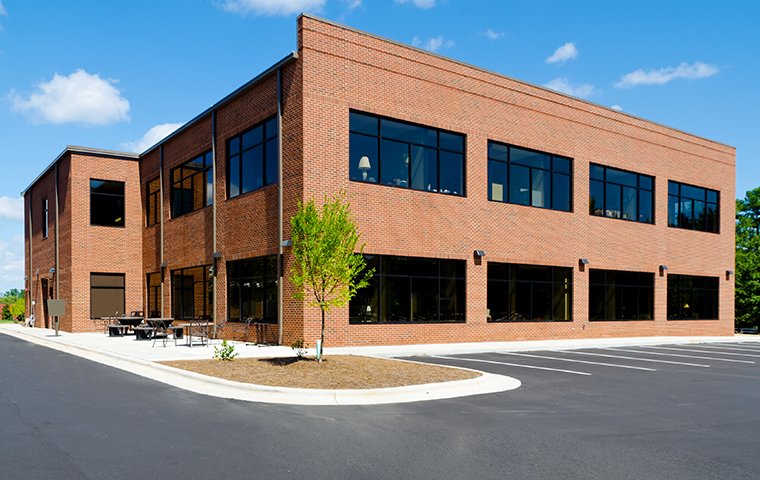We Design Custom Pest Control Plans street view of a brick commercial building in berks