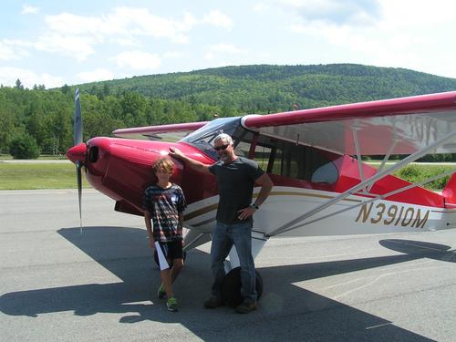 PILOT MIKE WELLS WITH A YOUNG EAGLE