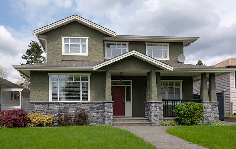 Protect Your Woodlands Home From Ants & Bed Bugs street view of a home in woodlands texas