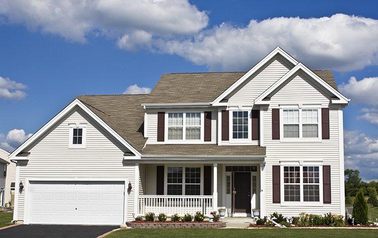 Protect Your Pearland, TX Home From Pests With Our Services street view of a suburban house in pearland texas