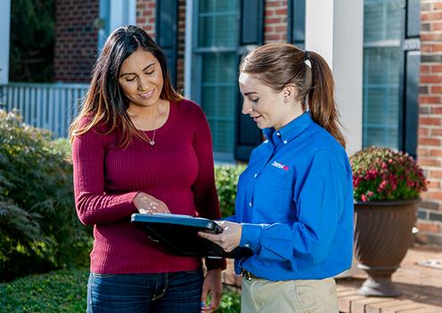 Positive Customer Relations Is Very Important To Us a service technician meeting with a customer in college park maryland