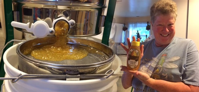 boiling honey in an industrial pot