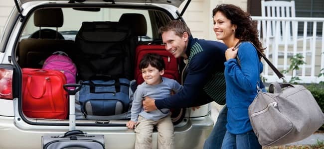 family packing car for trip