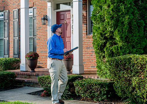 a pest control technician inspecting a home in severn maryland