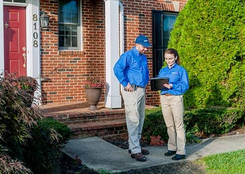 american pest technicians discussing an inspection in chantilly virginia