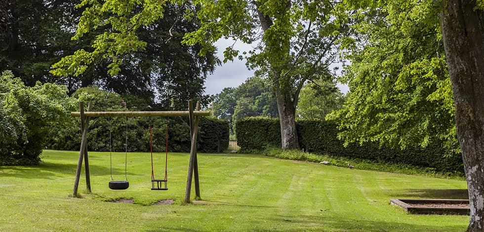 a well kept lawn with a swing set in brookeville maryland