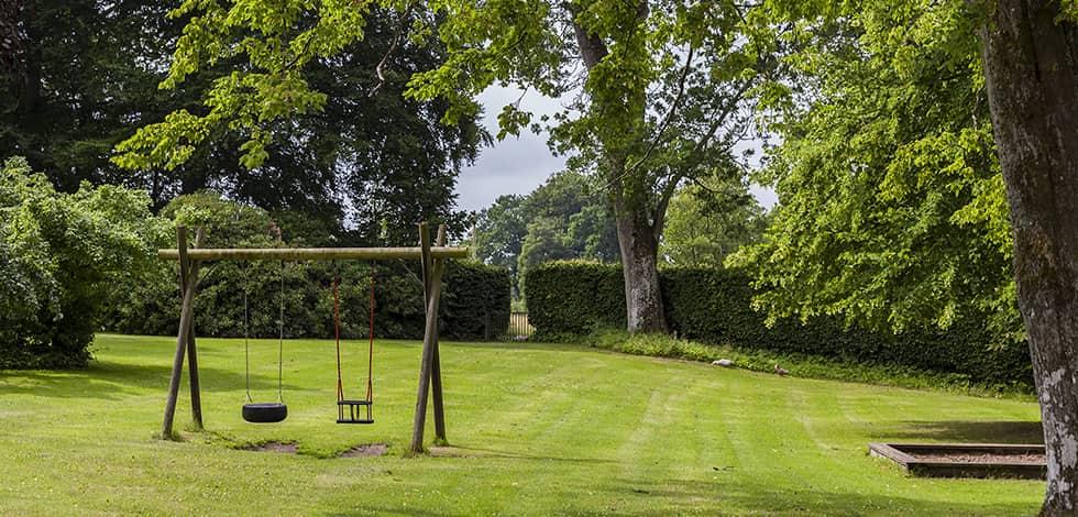 Remove Mouse Hiding Places By Keeping A Clean Yard a well kept lawn with a swing set in brookeville maryland