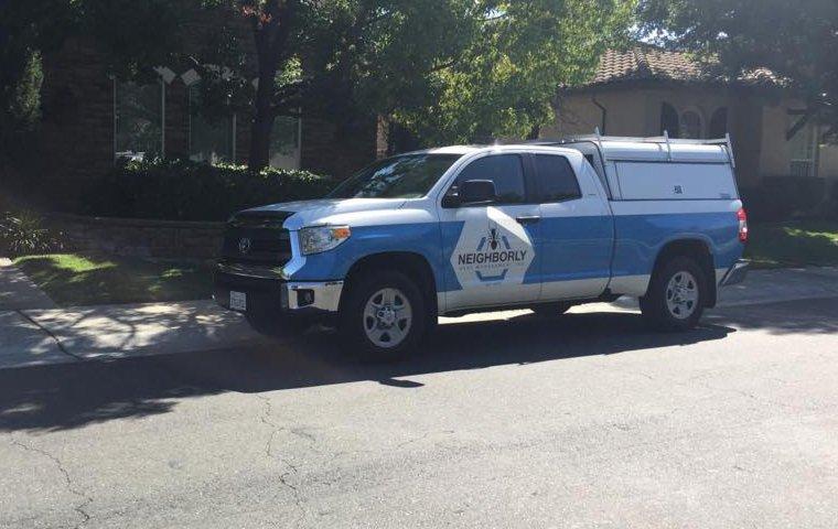 a neighborly pest management service vehicle