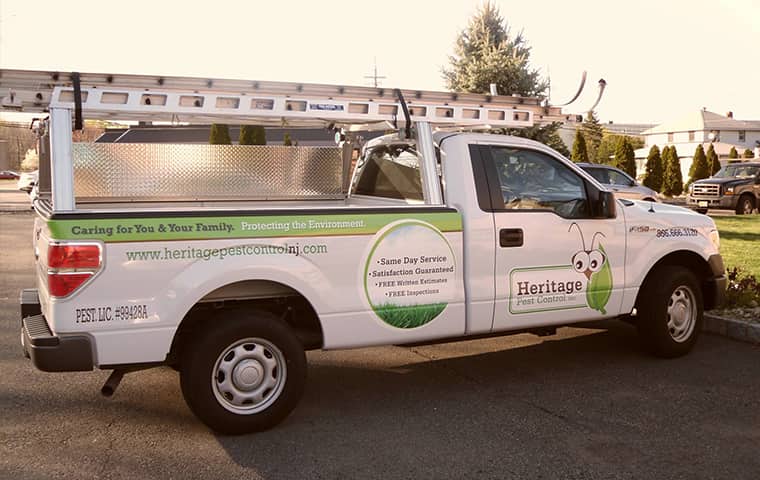 a heritage pest control company vehicle parked outside in pompton plains new jersey