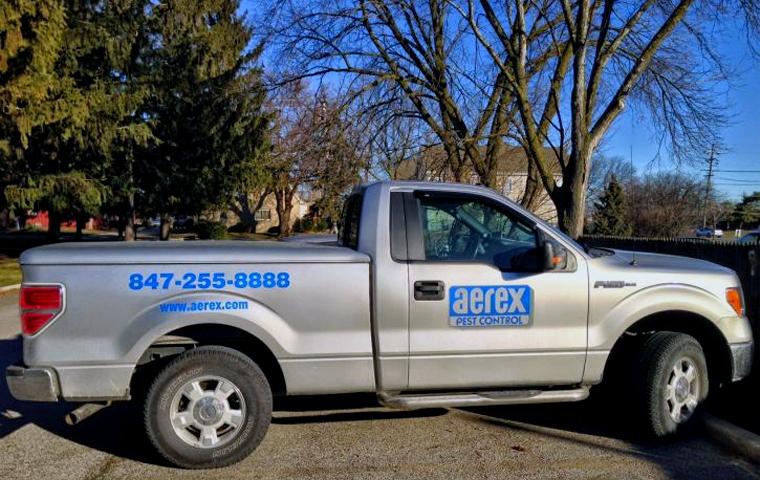 aerex pest control truck in front of house