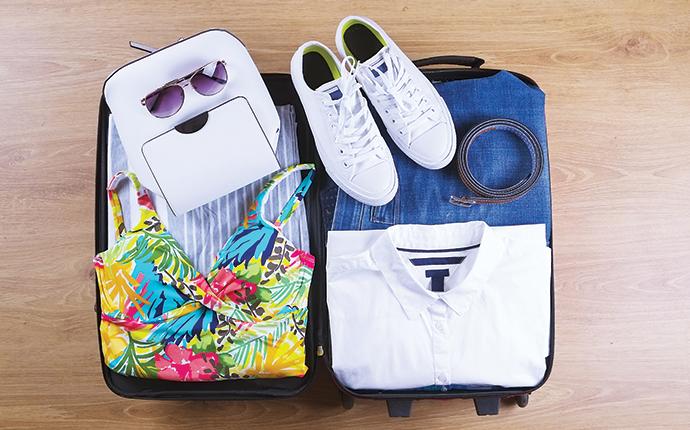 an open suitcase on a hotel room floor