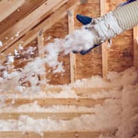 Save Money With Attic Insulation From Action Pest Control attic being filled with spray insulation