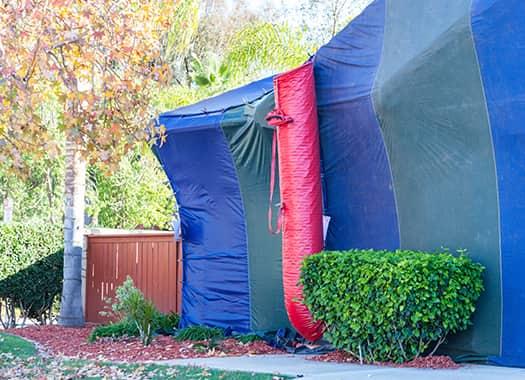 Control Pests From Infesting Your Home an evensville home tented and prepared for fumigation treatments this summer