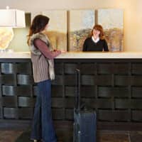 Be Prepared For Pest Sweeps In Indianapolis woman checking into a pest free hotel