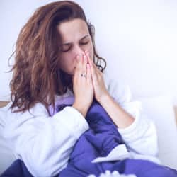 With Pest Control Services From Action Pest Control You Can Limit Your Exposure To Pest-Related Illnesses woman sick from pests in indianapolis