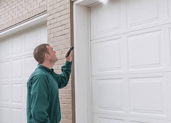 Comprehensive Home Inspection techncian inspecting garage