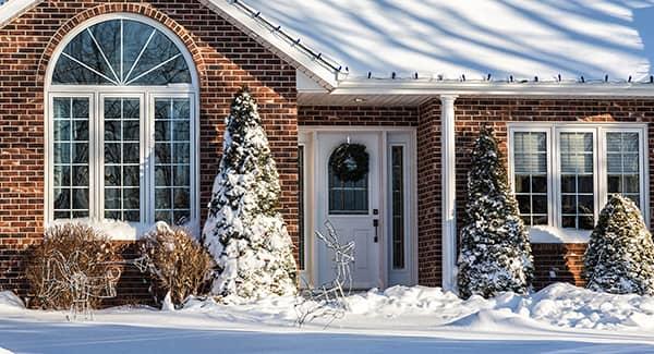 snow covered house in maine