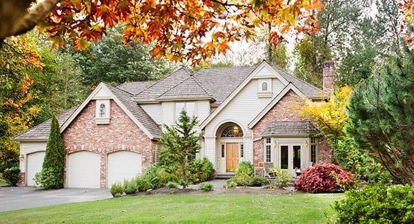 a beautiful brick home well landscaped in new england because it is fully protected against the many pests fall season bring along