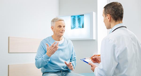 A doctor talking to a patient.