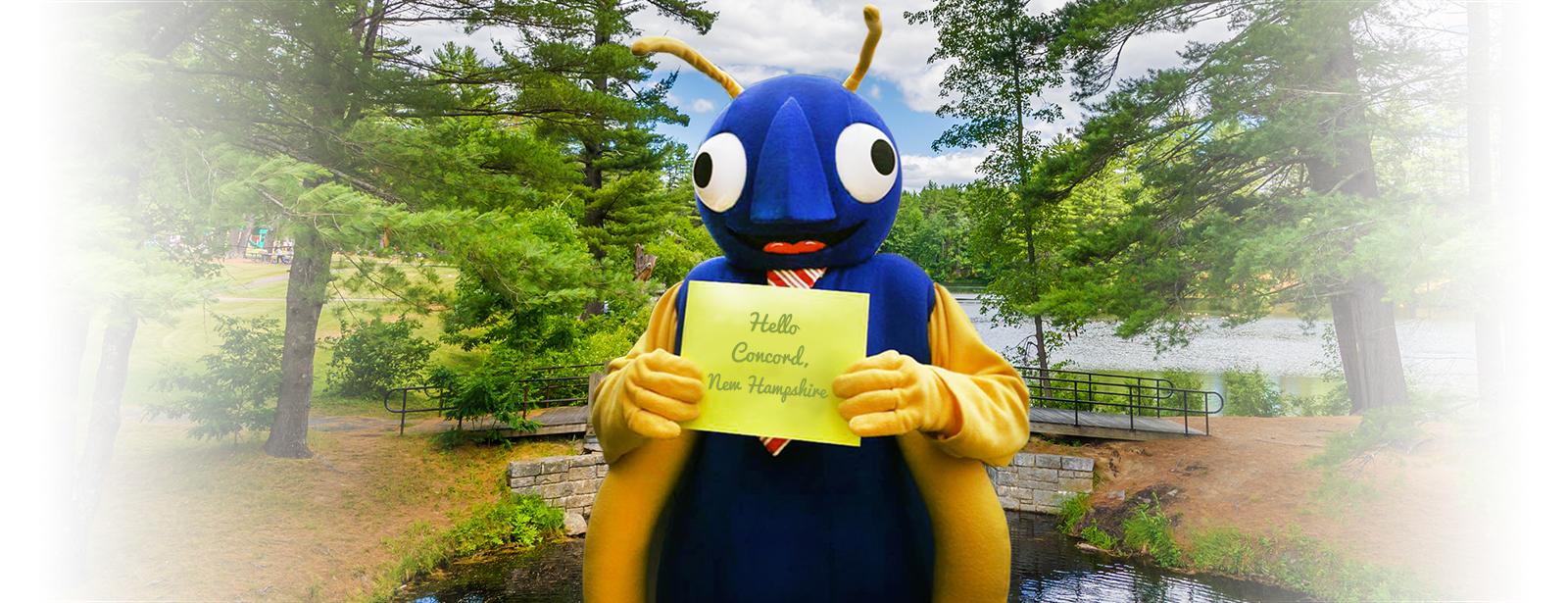 the company mascot holding a concord new hampshire sign