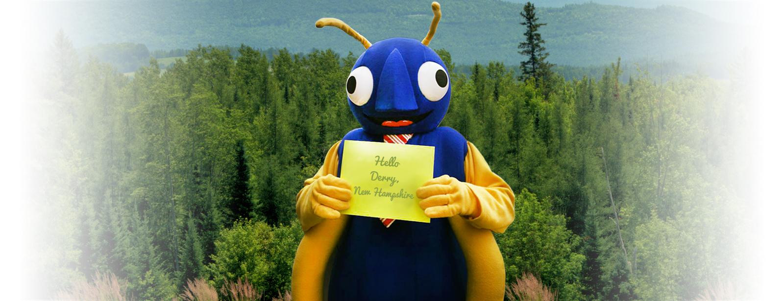 the company mascot holding a derry new hampshire sign