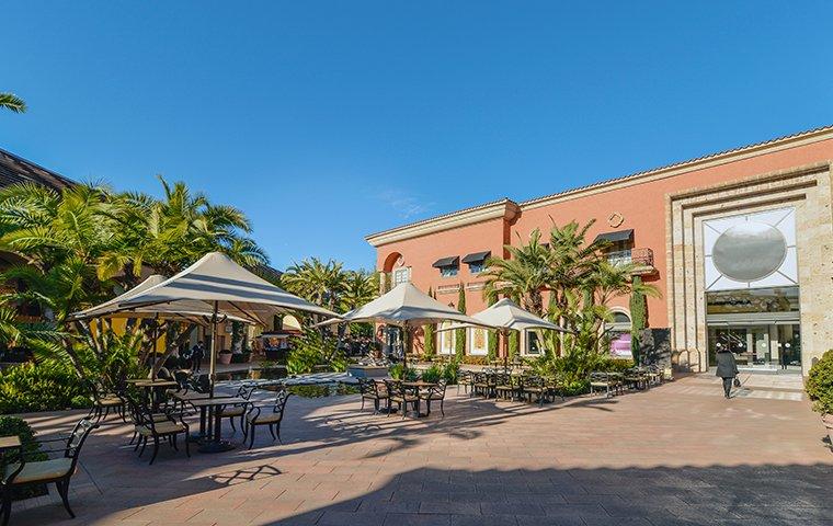 a sidewalk view of a commercial building in providenciales