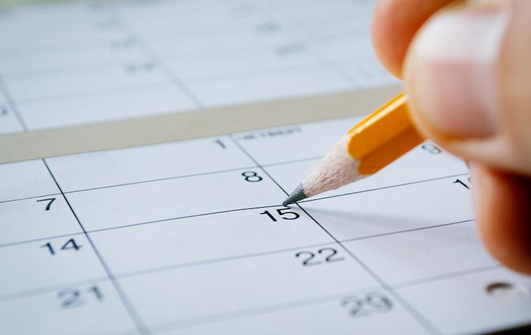 person marking the date on a calendar in mesa arizona