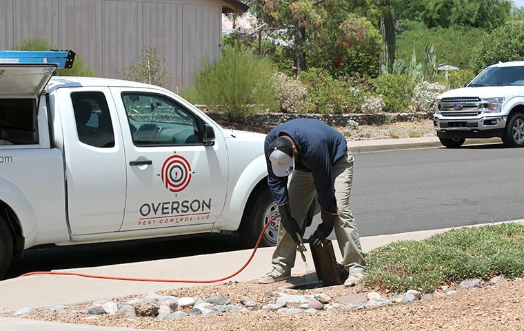 technician inspecting exterior in mesa arizona