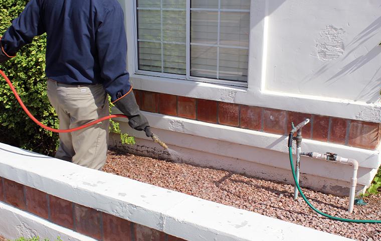 technician treating exterior in mesa arizona