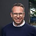 man with glasses smiling