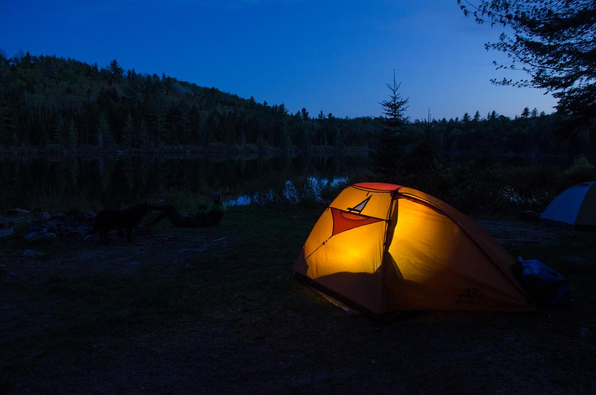 Falling asleep to the cheeps of peepers or the haunting call of loons makes camping in the north Maine Woods an experience to remember. Little Chase Stream Pond, Misery Township.