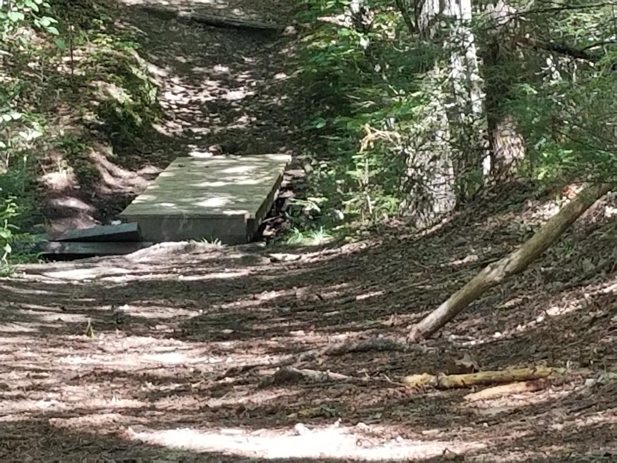 The steep hill with the bridge at the bottom. Photo credit: Enock Glidden