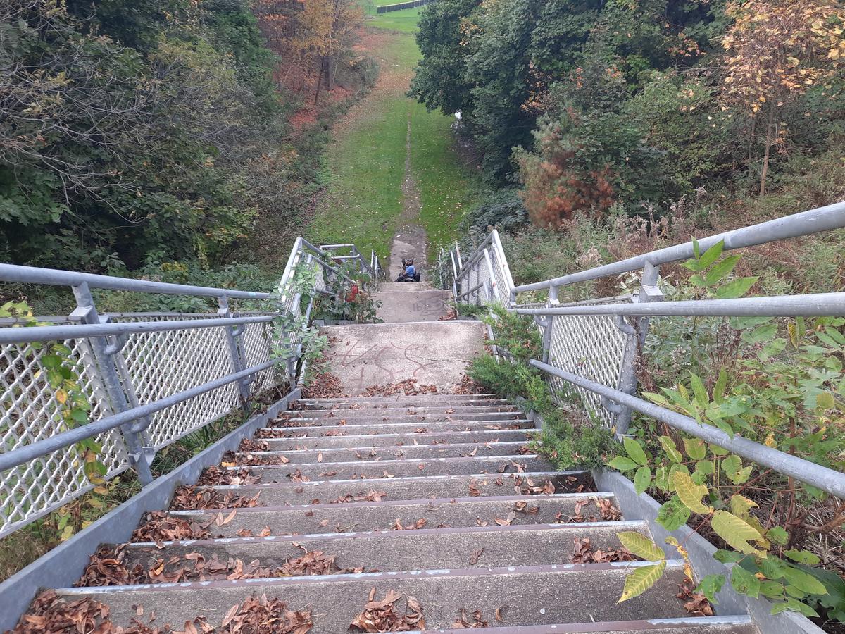 The stairway on the Greenway (with Enock at the bottom). Photo credit: Enock Glidden