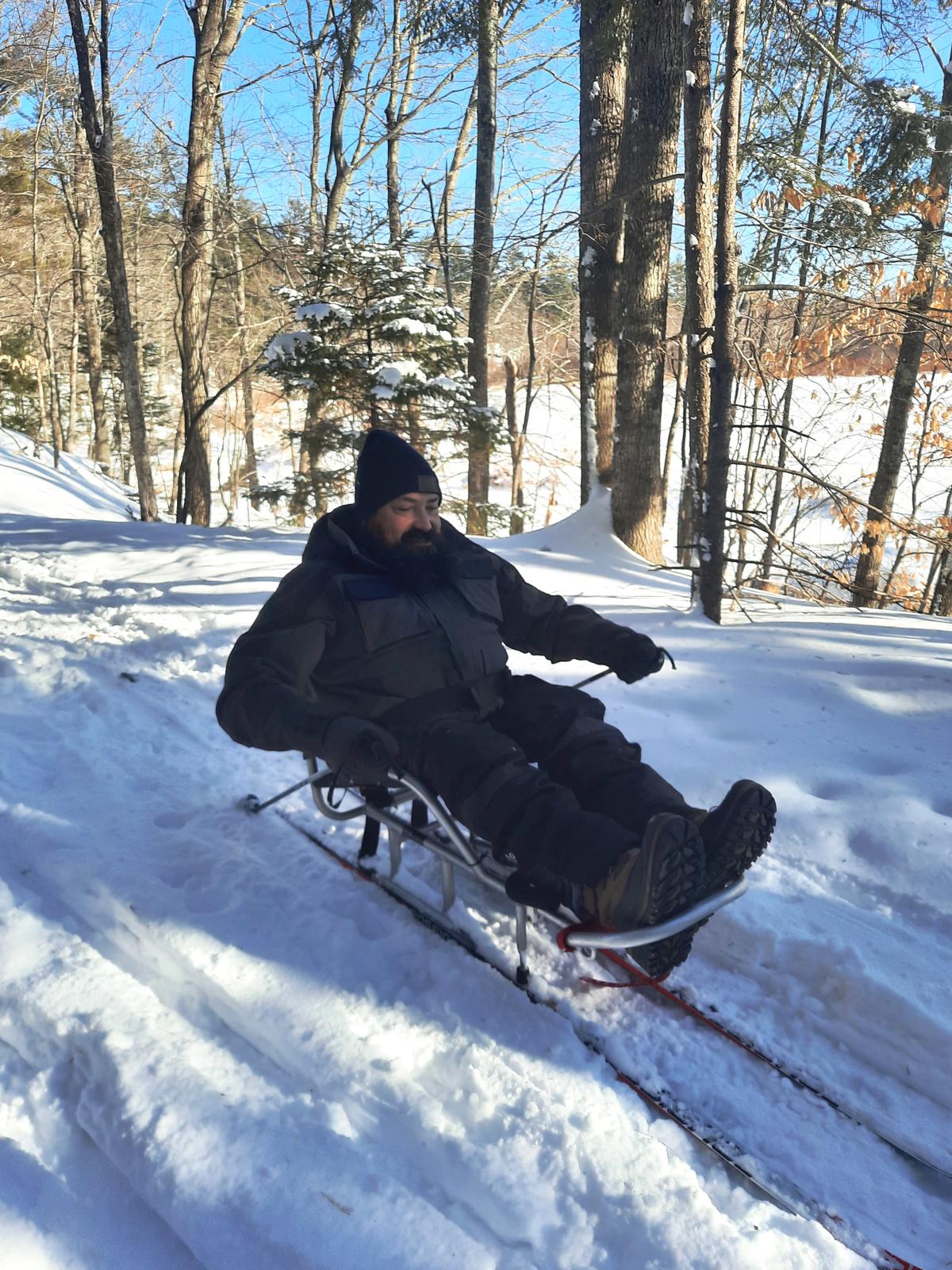 Enock on his sit-ski. Photo credit: Enock Glidden